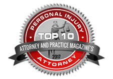 Badge representing "Top 10 Personal Injury Attorney and Practice Magazine's Law Firm 2017"